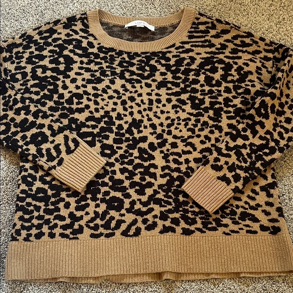 Left hip length leopard print sweater small